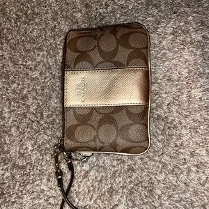 Coach wristlet with Cs. Pockets inside